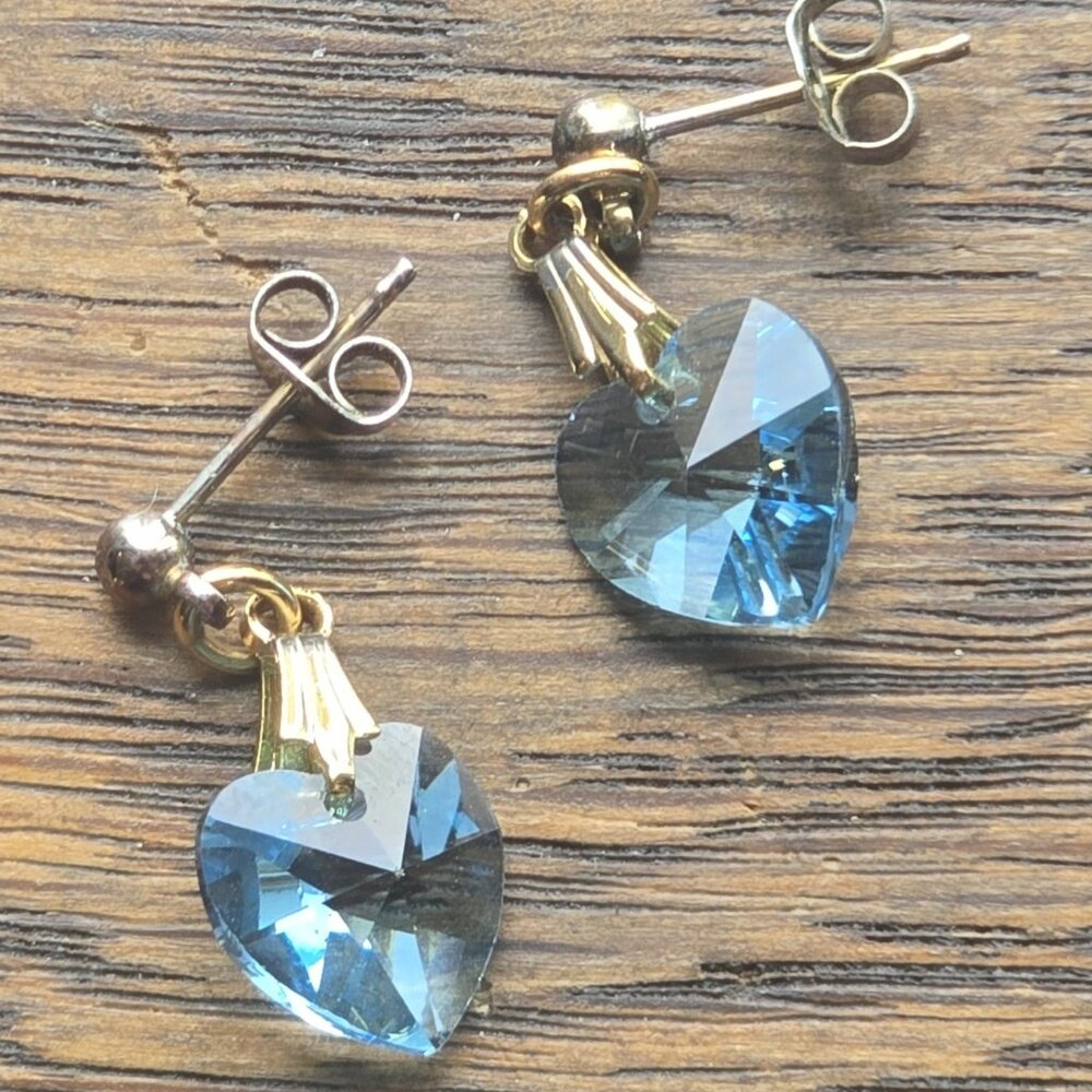Blue faceted crystal heart earrings.
